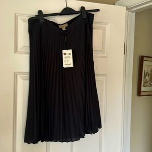 Authentic pleated midcalf Burberry skirt.Originally a part of a Burberry uniform